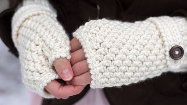 woman wearing a stylish fingerless mittens