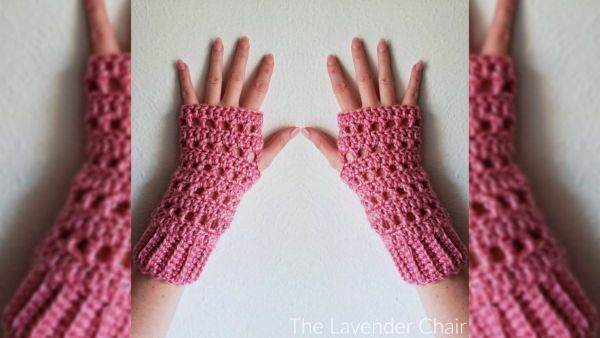 a person wearing a madison fingerless gloves