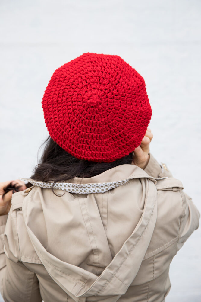 A woman wearing a double crochet beret