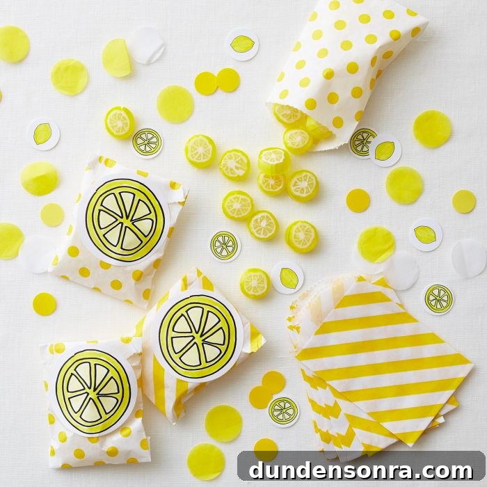 Overhead shot of lemon candies in yellow designed bags. 