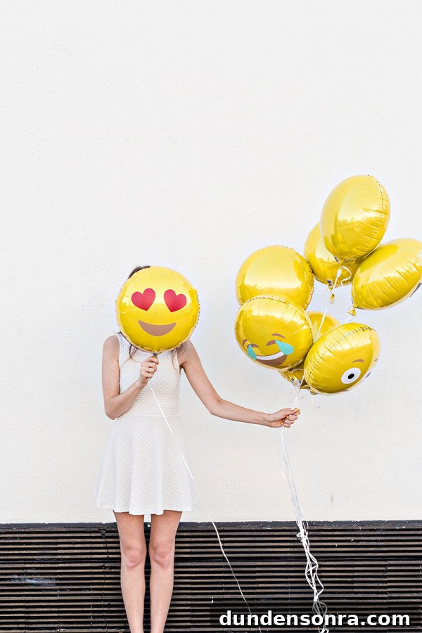 How to Make Emoji Balloons at Home: Fun DIY Guide 5 A person wearing a costume, with Emoji Balloons
