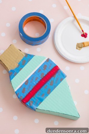Handmade Ornament Boxes: Step-by-Step DIY Gift Packaging Ideas 14 Colorful cardboard box and a plate with paint