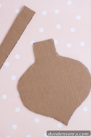 Cardboard shape on a pink surface 