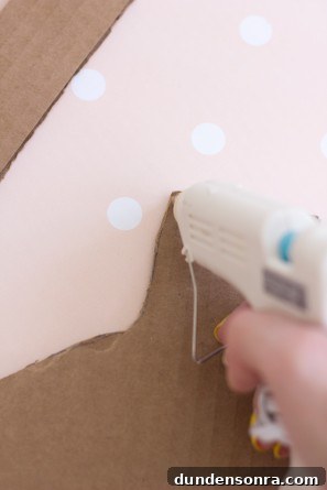 Handmade Ornament Boxes: Step-by-Step DIY Gift Packaging Ideas 8 Someone gluing cardboard