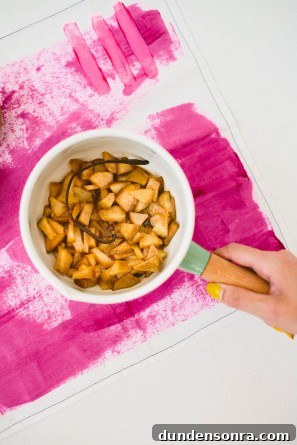 Someone holding a bowl with pears 