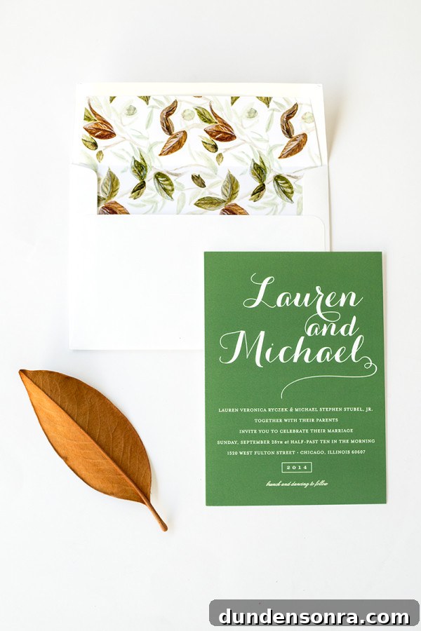 Green wedding invitation and leaves