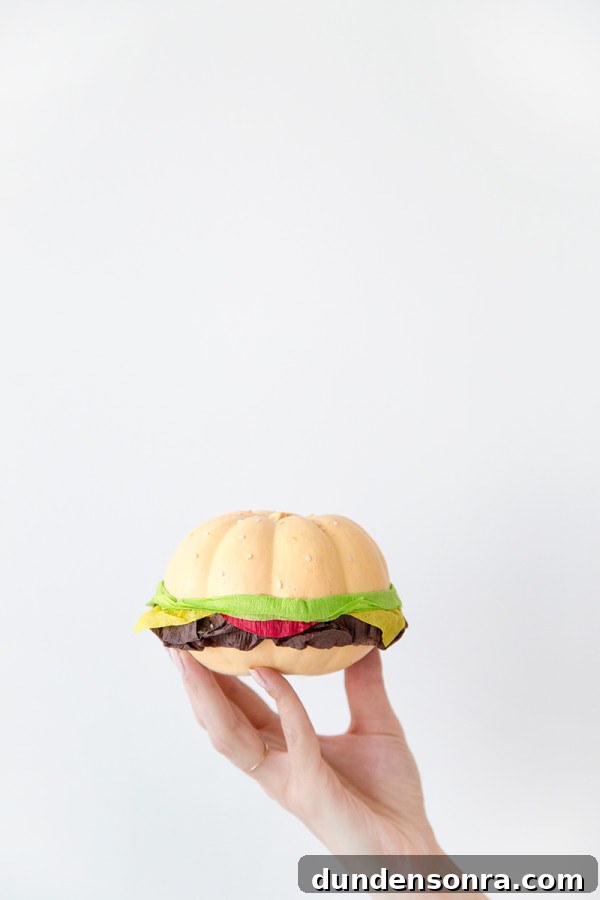 Someone holding a fake burger