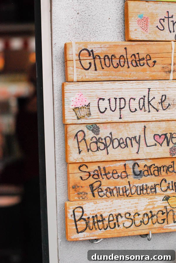 Wooden sign with black writing on it