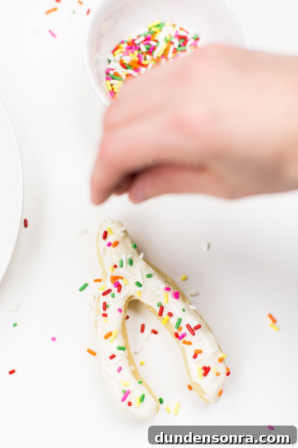 Wishbone Donuts: Classic Hand-Rolled Treats & Coffee Pairings 6 Someone putting sprinkles on a donut
