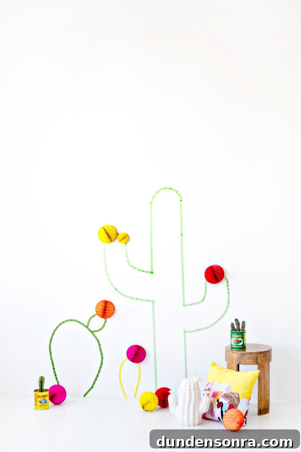 Washi Tape Cactus Wall Art Tutorial: Step-by-Step DIY Decor Guide 11 Cactus crafts on a wall with a table next to it