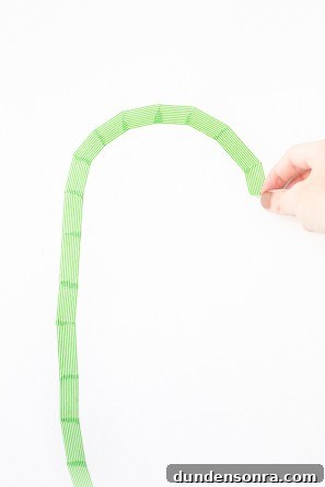 Washi Tape Cactus Wall Art Tutorial: Step-by-Step DIY Decor Guide 6 Someone using green tape
