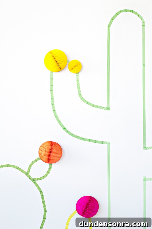 Washi Tape Cactus Wall Art Tutorial: Step-by-Step DIY Decor Guide 10 Orange and yellow paper spheres and green tape
