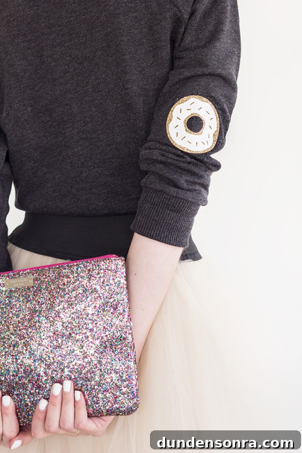 DIY Donut Elbow Patches: How to Sew Cute Patch Repairs 2 The back of someone wearing a sweater and skirt and holding a clutch