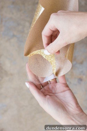DIY Donut Elbow Patches: How to Sew Cute Patch Repairs 5 Someone peeling a gold material