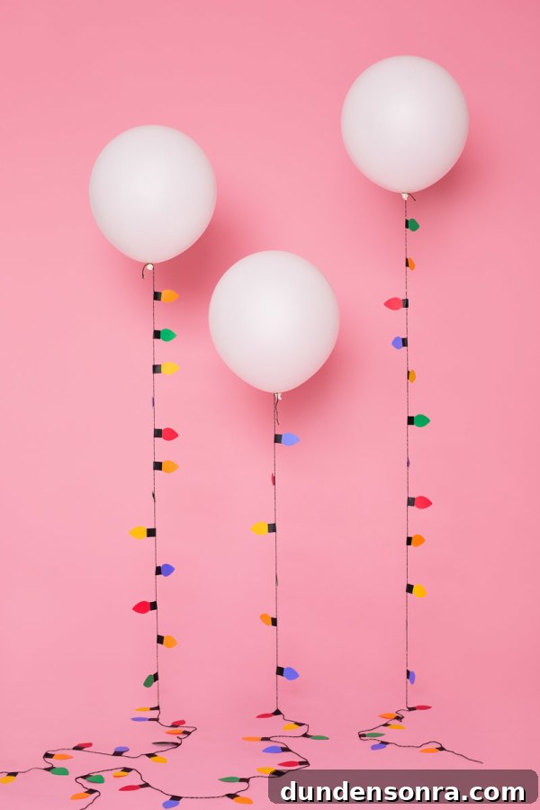 Paper Christmas lights attached to balloons 