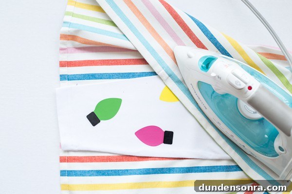 DIY Christmas Light Leggings: Make Festive LED Holiday Leggings 6 Someone ironing a rainbow fabric on leggings