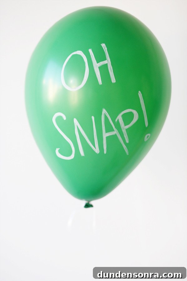 Green balloon that says "oh snap"