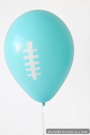 A blue balloon with white drawings on it