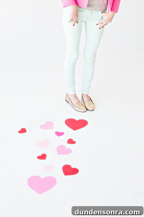 DIY Heart Floor Decals: Step-by-Step Guide to Stylish Home Floors 2 A person standing next to hearts on floors