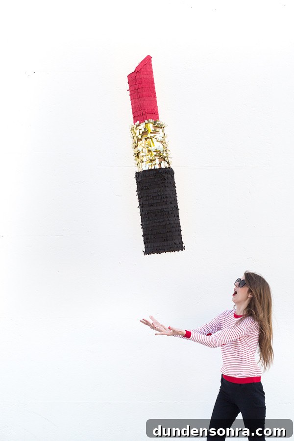 Someone throwing a lipstick piñata 