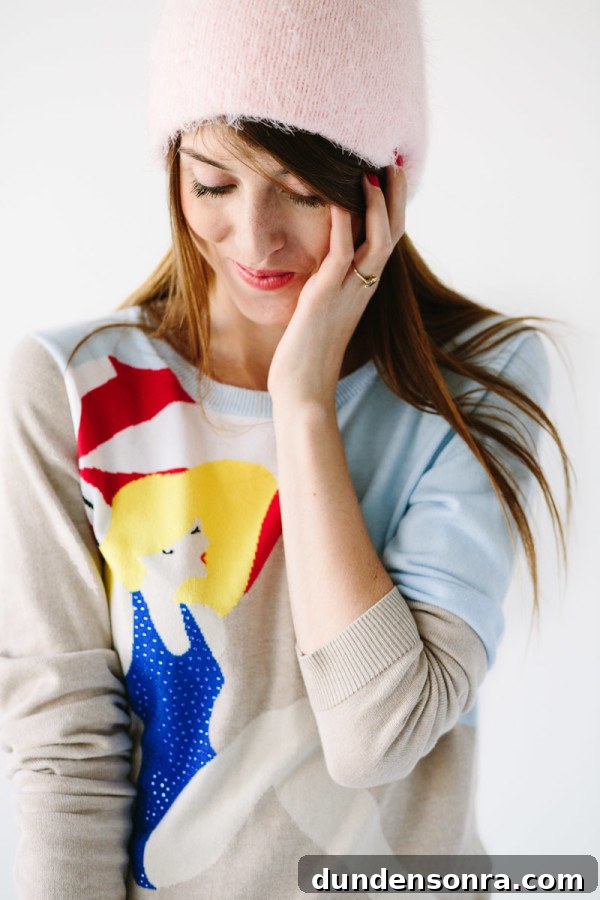 A woman in a sweater looking down