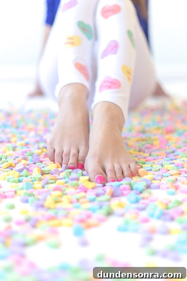 Someones feet and heart candies 