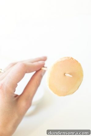 Someone poking a stick through a pancake 