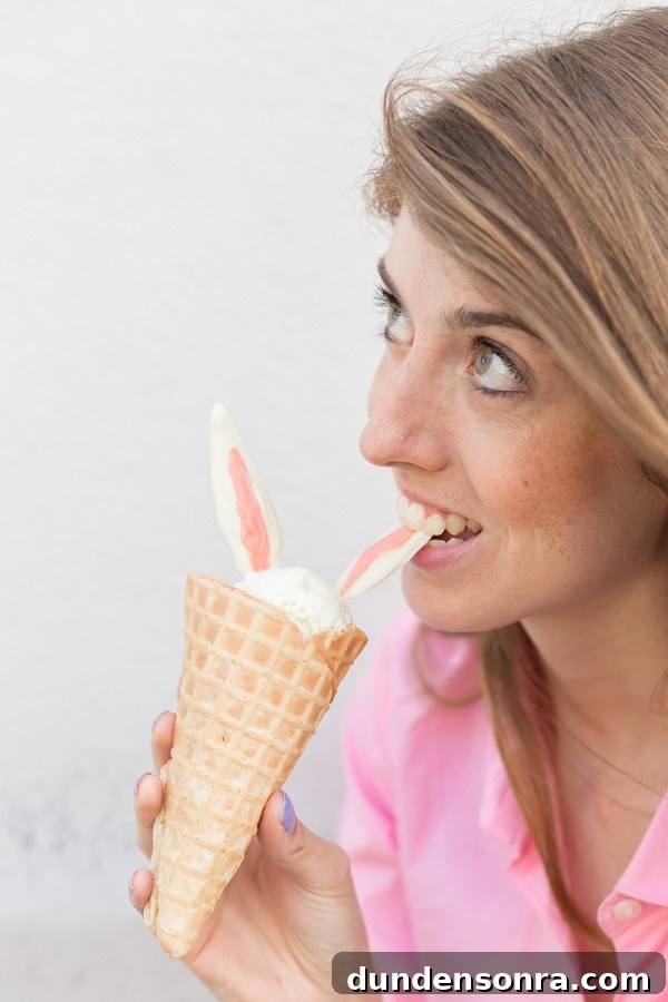 Someone biting bunny ear ice cream 