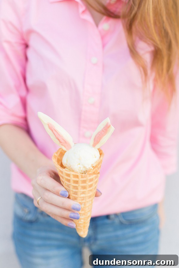 Someone holding bunny ear ice cream 