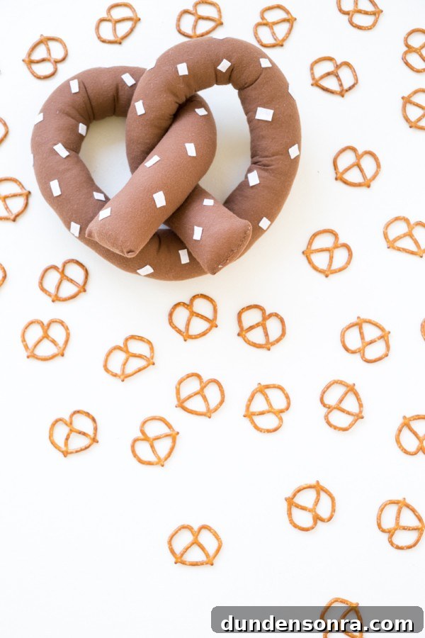 Pretzel pillow with pretzels next to it