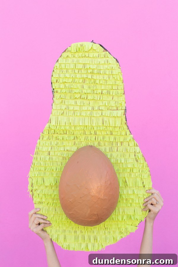 Someone holding an avocado 
