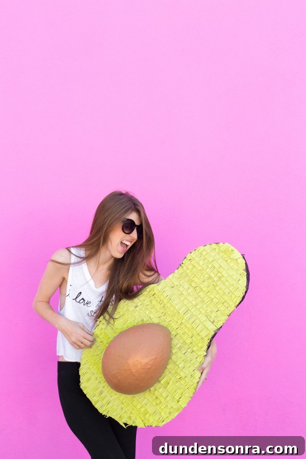 Someone holding an avocado 