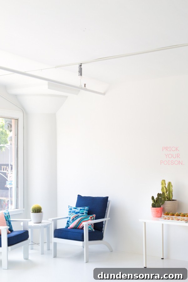 A white room with a blue chair