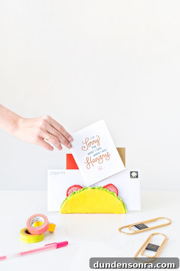 Someone putting a card in a taco holder