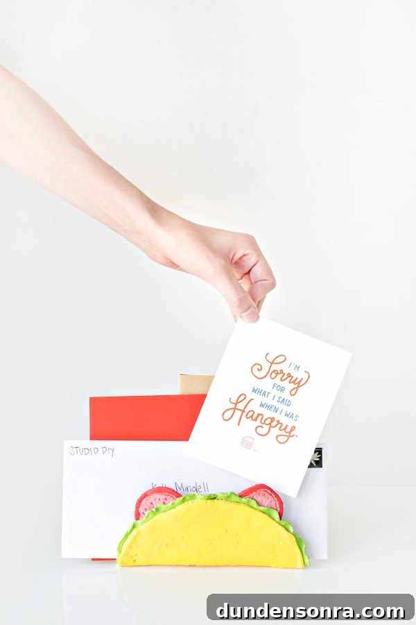 Someone putting cards in a taco letter holder