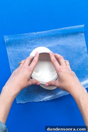Someone shaping clay