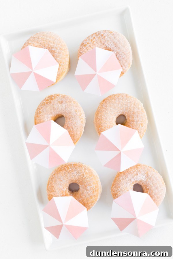 A box of donuts with umbrellas