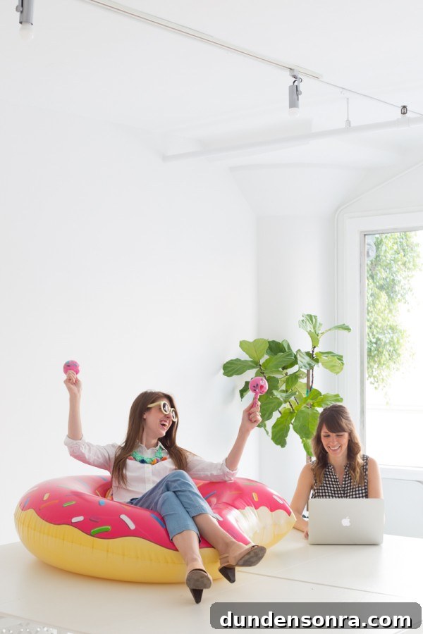 A woman sitting in a donut pool floatie