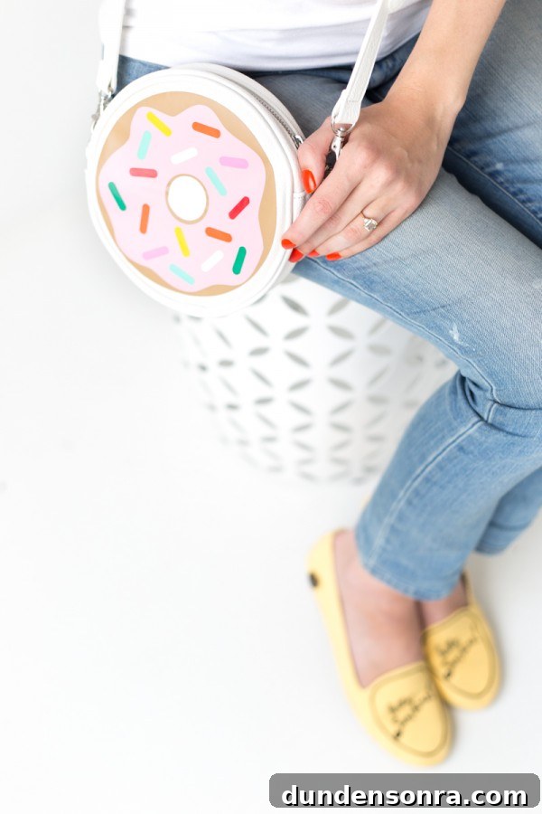 Someone holding a donut purse