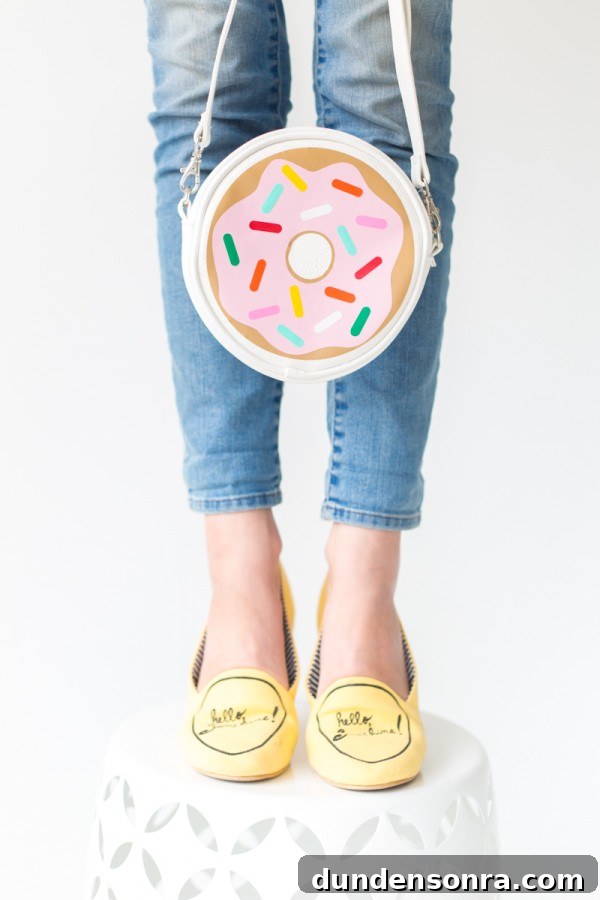 Someone holding a donut bag