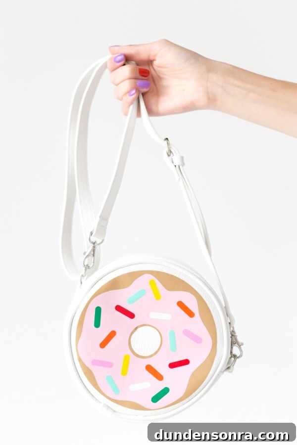 Someone holding a donut bag
