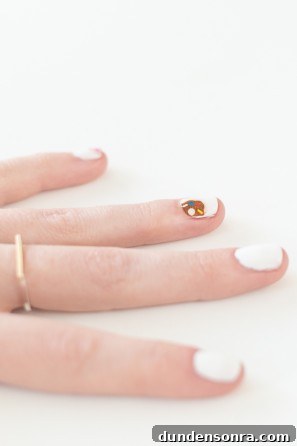 A close up of a hand with a ring
