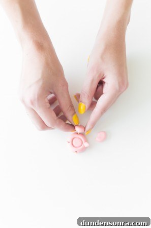 Someone putting clay together 