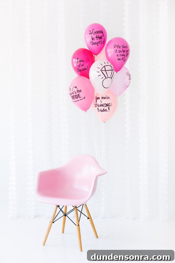 Balloon Wishes Ideas for the Bride-to-Be: Creative Bridal Shower Decor 4 Pink balloons with words on it and a pink chair