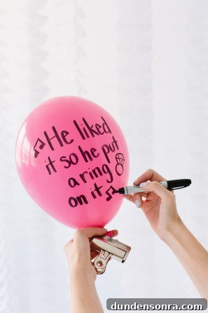Pink balloon with words on it
