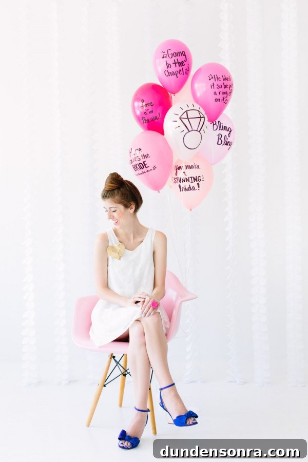 Balloon Wishes Ideas for the Bride-to-Be: Creative Bridal Shower Decor 10 A woman sitting on a chair with pink balloons