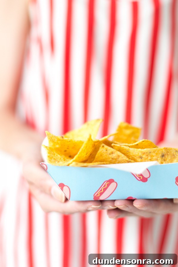Someone holding a tray with chips in it