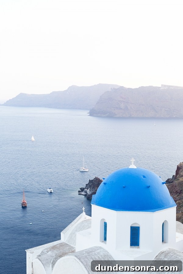 Honeymoon in Santorini: Meet the Mindells' Romantic Getaway 20 The top of a blue building on the coast