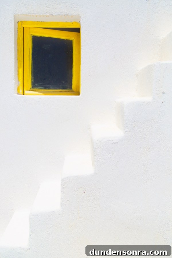 Honeymoon in Santorini: Meet the Mindells' Romantic Getaway 29 White stairs and a yellow window
