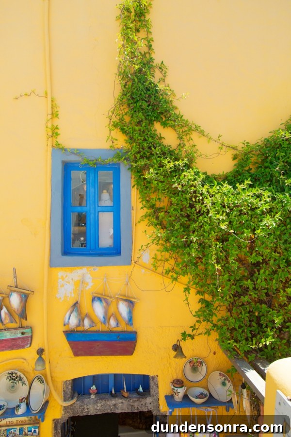 Honeymoon in Santorini: Meet the Mindells' Romantic Getaway 31 A yellow building with blue windows